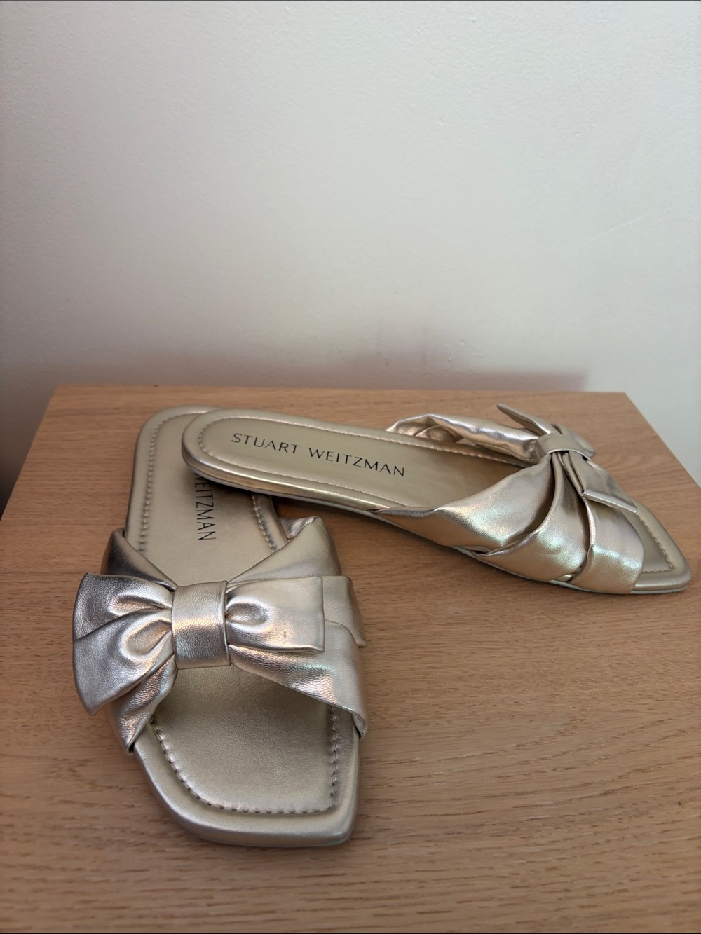 Stuart Weitzman Metallic Gold Bow Slide Mules